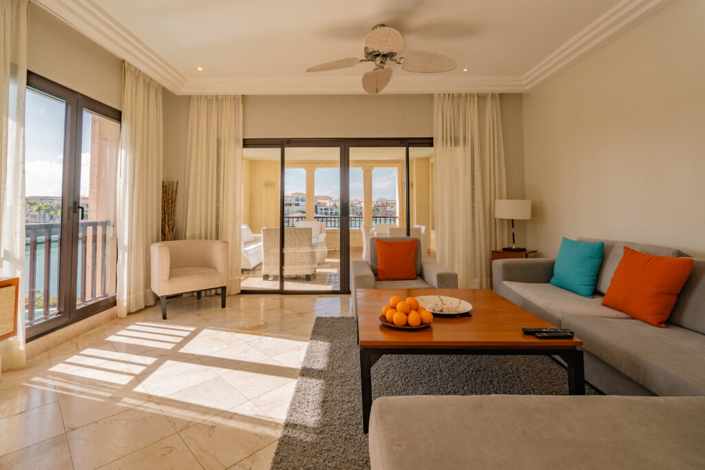 a living room filled with furniture and a flat screen tv