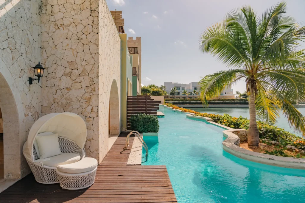 a pool with a lounge chair next to it