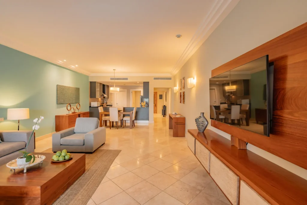 a living room filled with furniture and a flat screen tv